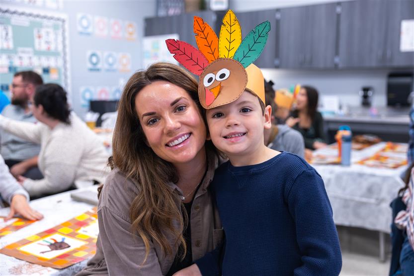 Creekside kindergartners and their families enjoy breakfast